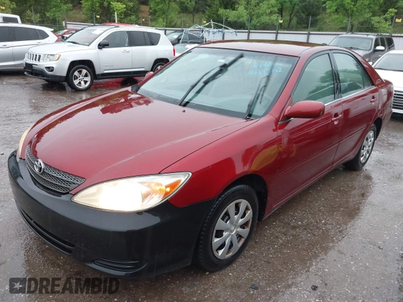 2003 Toyota Camry LE with VIN JTDBE32K630159278, listed as a IAAI auction lot 42148712 with 184,999 mi miles and . Bid and sale history available at DreamBid. Image 2.