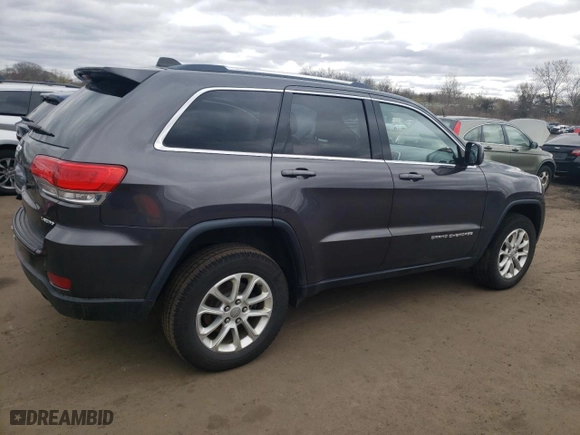 2015 Jeep Grand Cherokee Altitude with VIN 1C4RJFAG0FC209734, listed as a Copart auction lot 52973105 with 130,955 mi miles and Salvage Title. Bid and sale history available at carsss.com. Image 3.