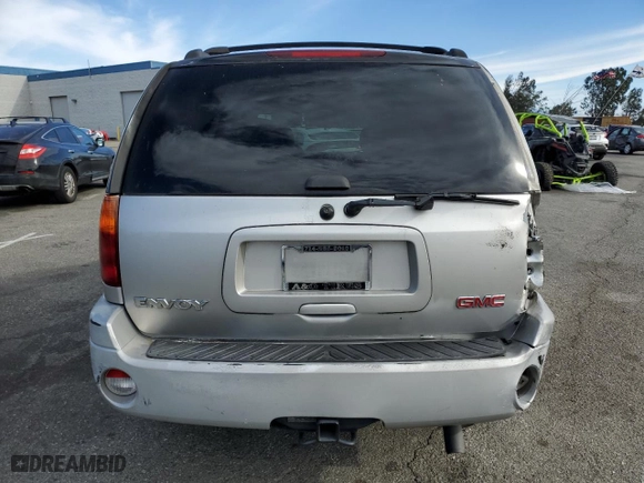 2005 GMC Envoy SLE with VIN 1GKDS13S852164983, listed as a Copart auction lot 87705025 with 158,065 mi miles and Salvage Title. Bid and sale history available at carsss.com. Image 6.