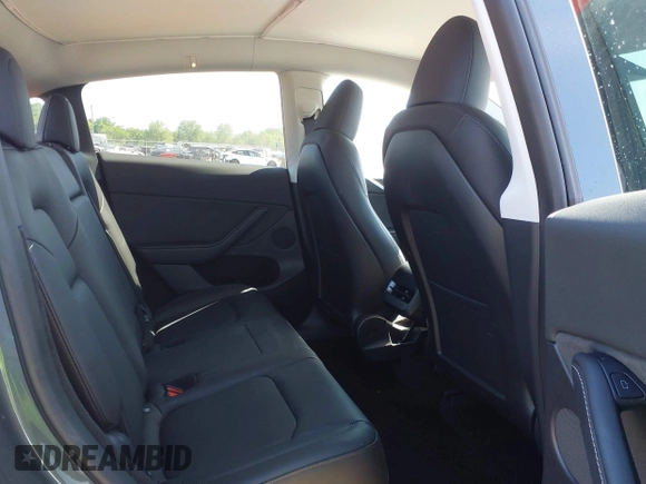 2023 Tesla Model Y Long Range with VIN 7SAYGDEE4PA037218, listed as a IAAI auction lot 42232704 with 18,756 mi miles and . Bid and sale history available at DreamBid. Image 8.
