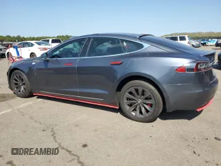 2019 Tesla Model S 100D с VIN 5YJSA1E42KF312803, выставлен на аукционе Copart как лот 71246484 с пробегом 89 820 миль миль и На запчасти • Non repairable. История ставок и продаж доступна на DreamBid. Изображение 2.