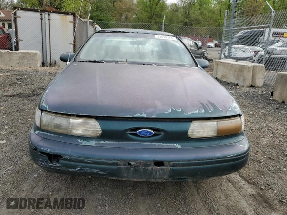 1995 Ford Taurus GL with VIN 1FALP52U8SA179395, listed as a Copart auction lot 53614265 with 71,082 mi miles and Salvage title. Bid and sale history available at DreamBid. Image 5.