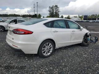 2020 Ford Fusion Hybrid SEL with VIN 3FA6P0MU8LR189560, listed as a Copart auction lot 76598364 with 57,443 mi miles and Salvage Title. Bid and sale history available at carsss.com. Image 3.