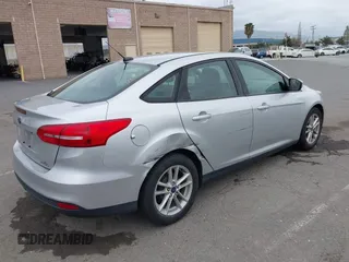 2015 Ford Focus SE z VIN 1FADP3F21FL218369, wystawiony jako IAAI lot #42126986 z przebiegiem 99 844 mil mil oraz . Historia ofert i sprzedaży dostępna na DreamBid. Obrazek 4.