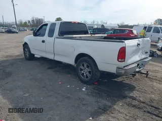 2000 Ford F-150 XL with VIN 1FTRX17LXYNC39983, listed as a IAAI auction lot 41750277 with 170,016 mi miles. Bid and sale history available at carsss.com. Image 3.