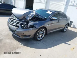 2014 Ford Taurus Limited with VIN 1FAHP2F89EG102814, listed as a IAAI auction lot 41999304 with 254,644 mi miles. Bid and sale history available at carsss.com. Image 2.