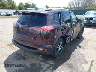 2016 Toyota RAV4 LE with VIN 2T3ZFREV8GW310580, listed as a IAAI auction lot 42063071 with 104,099 mi miles and . Bid and sale history available at DreamBid. Image 4.
