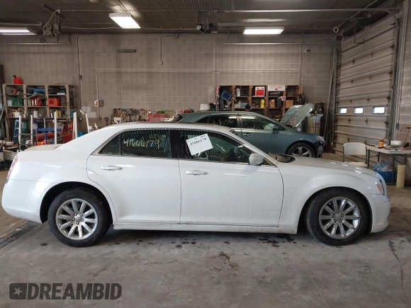 2014 Chrysler 300 with VIN 2C3CCAAGXEH217715, listed as a IAAI auction lot 41666179 with 145,744 mi miles and . Bid and sale history available at DreamBid. Image 13.