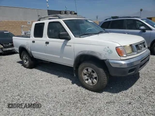2000 Nissan Frontier XE with VIN 1N6ED27T8YC436513, listed as a Copart auction lot 60338695 with 307,757 mi miles and Clean title. Bid and sale history available at DreamBid. Image 4.