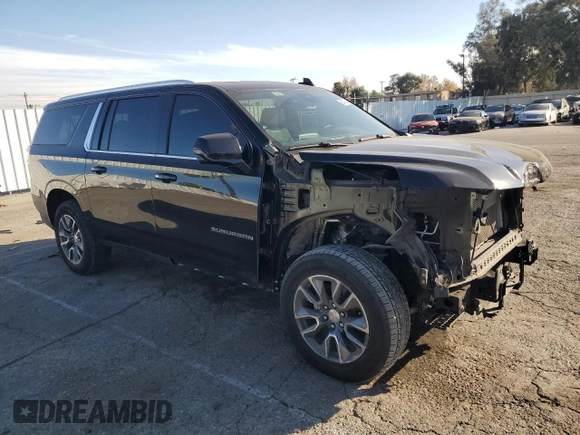 2023 Chevrolet Suburban LT with VIN 1GNSCCKD1PR124986, listed as a Copart auction lot 87432904 with 105,026 mi miles and Salvage Title. Bid and sale history available at DreamBid. Image 4.