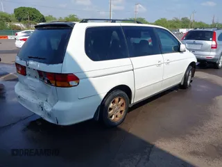 2002 Honda Odyssey EX z VIN 2HKRL18632H556791, wystawiony jako IAAI lot #41562553 z przebiegiem 222 976 mil mil oraz . Historia ofert i sprzedaży dostępna na DreamBid. Obrazek 4.