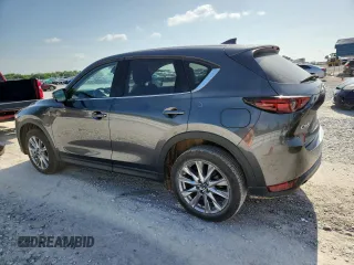 2020 Mazda CX-5 Grand Touring z VIN JM3KFADM2L0803589, wystawiony jako Copart lot #61916825 z przebiegiem 63 663 mil mil oraz Szkoda całkowita • Salvage title. Historia ofert i sprzedaży dostępna na DreamBid. Obrazek 2.