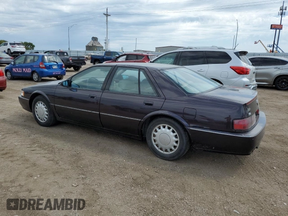 1992 Cadillac Seville z VIN 1G6KY53BXNU804126, wystawiony jako Copart lot #69219394 z przebiegiem 100 647 mil mil oraz Czysty tytuł • Clean title. Historia ofert i sprzedaży dostępna na DreamBid. Obrazek 2.