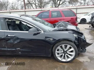 2018 Tesla Model 3 Long Range Battery with VIN 5YJ3E1EB3JF090567, listed as a IAAI auction lot 41568312 with 35,327 mi miles and . Bid and sale history available at DreamBid. Image 20.