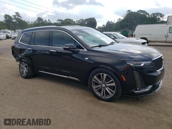 2020 Cadillac XT6 FWD Premium Luxury with VIN 1GYKPCRS6LZ102682, listed as a Copart auction lot 56906645 with 76,884 mi miles and Salvage title. Bid and sale history available at DreamBid. Image 4.