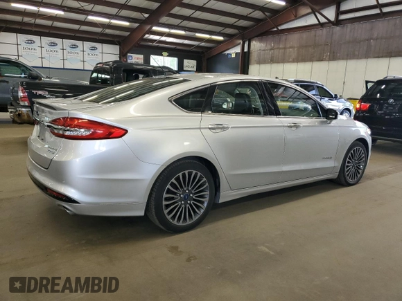 2017 Ford Fusion Hybrid Titanium z VIN 3FA6P0RU1HR300370, wystawiony jako Copart lot #65206605 z przebiegiem 150 424 mil mil oraz Czysty tytuł • Clean title. Historia ofert i sprzedaży dostępna na DreamBid. Obrazek 3.