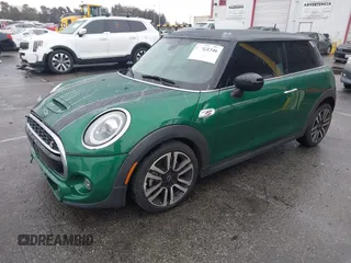 2020 MINI Hardtop Cooper S z VIN WMWXR5C08L2L85651, wystawiony jako IAAI lot #41521346 z przebiegiem 40 863 mil mil oraz . Historia ofert i sprzedaży dostępna na DreamBid. Obrazek 18.