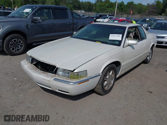 2000 Cadillac Eldorado Touring ETC z VIN 1G6ET129XYU162451, wystawiony jako IAAI lot #42412406 z przebiegiem 89 413 mil mil oraz . Historia ofert i sprzedaży dostępna na DreamBid. Obrazek 2.