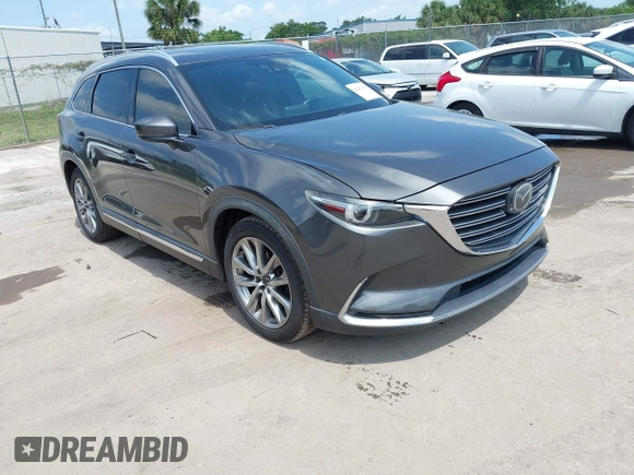2016 Mazda CX-9 Signature with VIN JM3TCBEY9G0100579, listed as a IAAI auction lot 42282293 with 142,700 mi miles and . Bid and sale history available at DreamBid. Image 1.