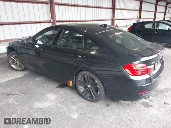 2015 BMW 4 Series 428i xDrive with VIN WBA4C9C57FD331872, listed as a IAAI auction lot 42276675 with 106,543 mi miles and . Bid and sale history available at DreamBid. Image 3.