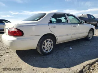 2001 Mazda 626 LX with VIN 1YVGF22C815240640, listed as a Copart auction lot 47609315 with 0 mi miles and Salvage Title. Bid and sale history available at carsss.com. Image 3.