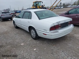 1999 Buick Park Avenue Ultra with VIN 1G4CU5217X4658627, listed as a IAAI auction lot 42013174 with 148,856 mi miles. Bid and sale history available at carsss.com. Image 3.