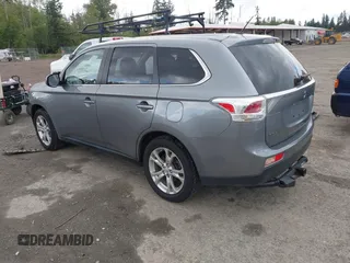 2014 Mitsubishi Outlander GT with VIN JA4JZ4AX9EZ017406, listed as a IAAI auction lot 42291696 with 107,680 mi miles and . Bid and sale history available at DreamBid. Image 3.