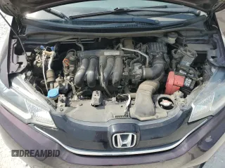 2015 Honda Fit EX-L z VIN 3HGGK5H8XFM777535, wystawiony jako Copart lot #59304185 z przebiegiem 106 393 mil mil oraz Szkoda całkowita • Salvage title. Historia ofert i sprzedaży dostępna na DreamBid. Obrazek 11.