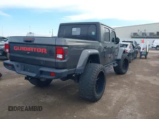 2023 Jeep Gladiator Sport S z VIN 1C6HJTAG9PL554845, wystawiony jako IAAI lot #41312360 z przebiegiem 18 077 mil mil oraz . Historia ofert i sprzedaży dostępna na DreamBid. Obrazek 4.