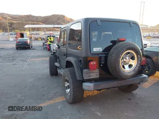 2004 Jeep Wrangler SE with VIN 1J4FA29184P762210, listed as a IAAI auction lot 40983051 with 107,525 mi miles and . Bid and sale history available at DreamBid. Image 3.