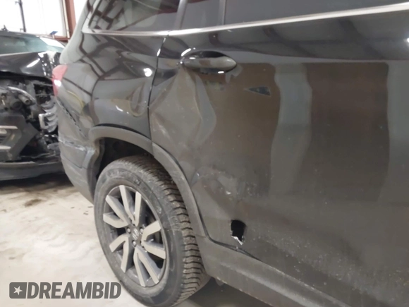 2019 Honda Pilot EX-L with VIN 5FNYF6H5XKB067858, listed as a IAAI auction lot 41643807 with 102,114 mi miles and . Bid and sale history available at carsss.com. Image 13.