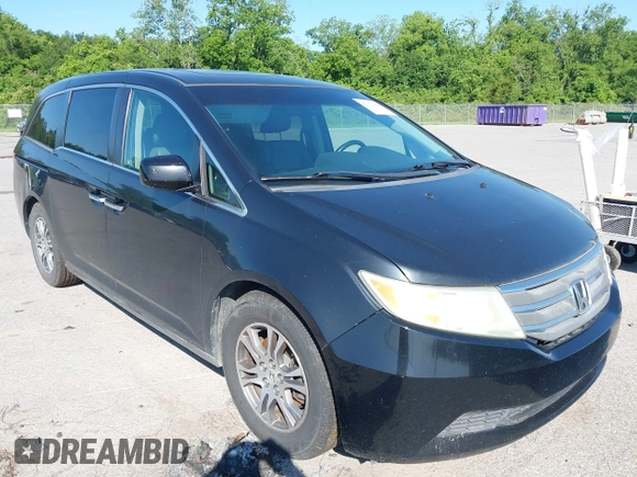 2011 Honda Odyssey EX-L with VIN 5FNRL5H66BB058333, listed as a IAAI auction lot 42172045 with 215,723 mi miles and . Bid and sale history available at carsss.com. Image 1.