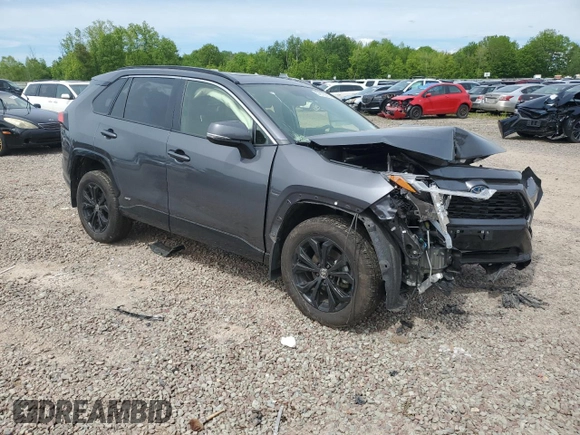 2023 Toyota RAV4 Hybrid SE with VIN JTM16RFVXPD088729, listed as a Copart auction lot 57879395 with 33,249 mi miles and Salvage title. Bid and sale history available at DreamBid. Image 4.