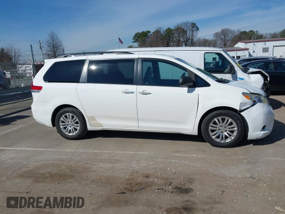 2011 Toyota Sienna XLE AAS with VIN 5TDYK3DCXBS043733, listed as a IAAI auction lot 41601544 with 221,658 mi miles and . Bid and sale history available at DreamBid. Image 13.