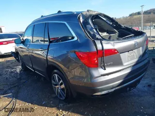 2017 Honda Pilot Touring with VIN 5FNYF6H92HB046966, listed as a IAAI auction lot 41117876 with 140,564 mi miles. Bid and sale history available at carsss.com. Image 3.