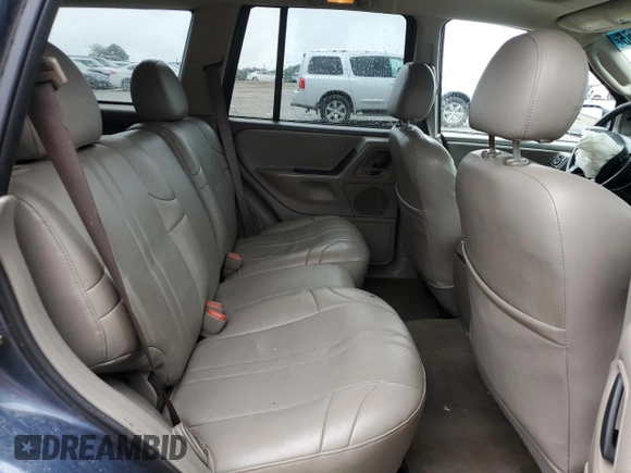 2004 Jeep Grand Cherokee Laredo with VIN 1J4GX48SX4C201569, listed as a Copart auction lot 58631585 with 271,124 mi miles and Salvage title. Bid and sale history available at DreamBid. Image 11.