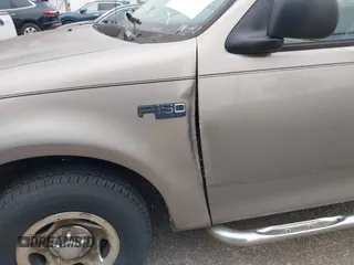2002 Ford F-150 XL with VIN 3FTRF17212MA23970, listed as a IAAI auction lot 40991449 with 216,487 mi miles. Bid and sale history available at carsss.com. Image 6.
