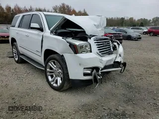 2019 GMC Yukon SLT with VIN 1GKS2BKC2KR338007, listed as a Copart auction lot 82336394 with 105,087 mi miles and Salvage Title. Bid and sale history available at carsss.com. Image 12.