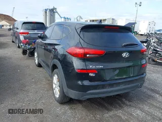 2019 Hyundai Tucson SE with VIN KM8J2CA46KU977863, listed as a IAAI auction lot 41704318 with 23,076 mi miles. Bid and sale history available at carsss.com. Image 3.