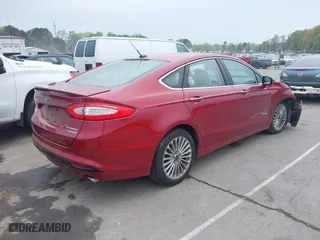 2014 Ford Fusion Titanium Hybrid with VIN 3FA6P0RU9ER349599, listed as a IAAI auction lot 41928864 with 94,312 mi miles. Bid and sale history available at carsss.com. Image 4.