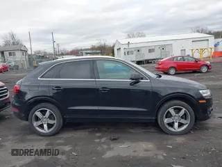 2015 Audi Q3 Premium Plus z VIN WA1EFCFS6FR012425, wystawiony jako IAAI lot #42042484 z przebiegiem 139 012 mil mil oraz . Historia ofert i sprzedaży dostępna na DreamBid. Obrazek 13.