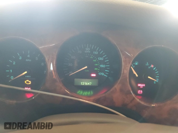2000 Jaguar XJ with VIN SAJDA25B8YMF04079, listed as a Copart auction lot 50592595 with 131,647 mi miles and Salvage title. Bid and sale history available at DreamBid. Image 9.