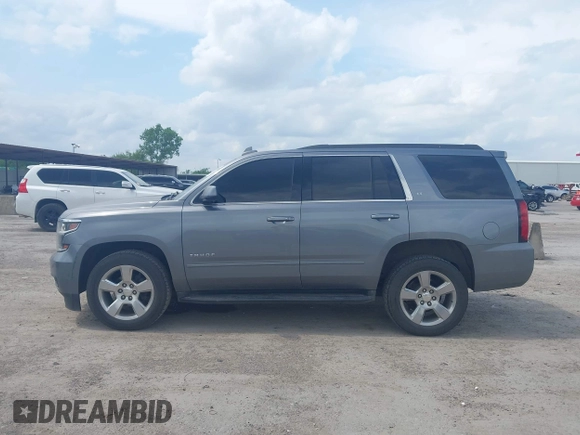 2019 Chevrolet Tahoe LT z VIN 1GNSCBKC8KR406519, wystawiony jako IAAI lot #42145021 z przebiegiem 74 694 mil mil oraz . Historia ofert i sprzedaży dostępna na DreamBid. Obrazek 14.