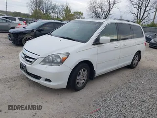 2007 Honda Odyssey EX-L with VIN 5FNRL38607B403903, listed as a IAAI auction lot 42074718 with 148,816 mi miles. Bid and sale history available at carsss.com. Image 2.