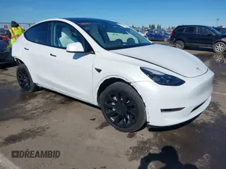 2023 Tesla Model Y Long Range z VIN 7SAYGDEE0PF945202, wystawiony jako IAAI lot #41611762 z przebiegiem 7 316 mil mil oraz . Historia ofert i sprzedaży dostępna na DreamBid. Obrazek 1.