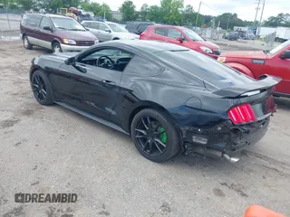 2016 Ford Mustang V6 z VIN 1FA6P8AM8G5251387, wystawiony jako IAAI lot #42231334 z przebiegiem 104 618 mil mil oraz . Historia ofert i sprzedaży dostępna na DreamBid. Obrazek 3.