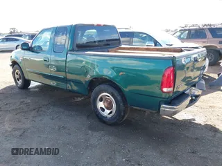 2000 Ford F-150 XL with VIN 1FTRX17L0YKA94650, listed as a IAAI auction lot 41720452 with 112,013 mi miles. Bid and sale history available at carsss.com. Image 3.