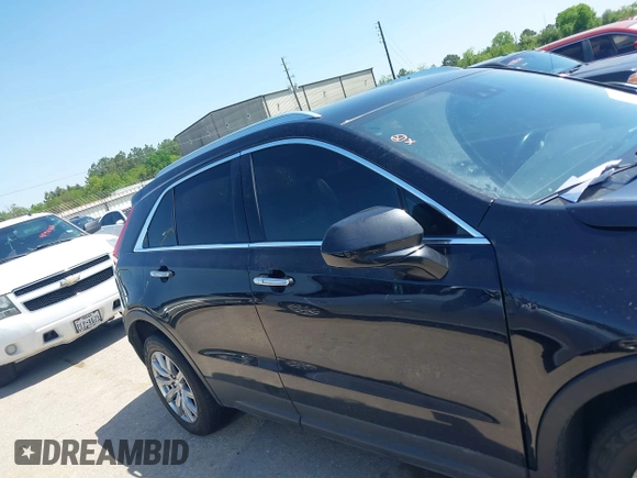 2019 Cadillac XT4 FWD Premium Luxury z VIN 1GYFZCR48KF141478, wystawiony jako IAAI lot #41988092 z przebiegiem 53 970 mil mil oraz . Historia ofert i sprzedaży dostępna na DreamBid. Obrazek 13.