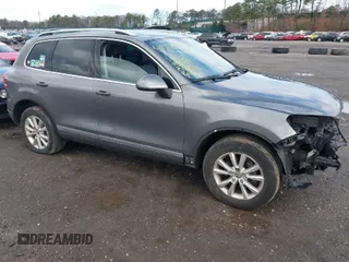2013 Volkswagen Touareg Lux with VIN WVGEF9BPXDD000679, listed as a IAAI auction lot 41956471 with 117,465 mi miles and . Bid and sale history available at DreamBid. Image 1.
