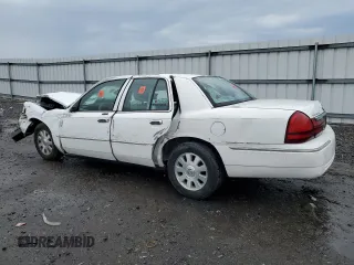2003 Mercury Grand Marquis LS Premium with VIN 2MEFM75W13X667779, listed as a Copart auction lot 52869985 with 127,506 mi miles and Salvage Title. Bid and sale history available at DreamBid. Image 2.